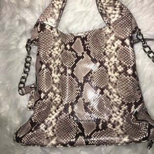 Michael Kors rare python purse in mint condition.